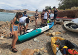Feelfree Corona is once again the largest kayak on the beach, but also one of the most user-friendly for a father and his children. FeelFree Juntos is in the foreground, able to carry plenty of gear. Guided tour with Dig Paddlesports at Quail Creek State Park in Hurricane, Utah.